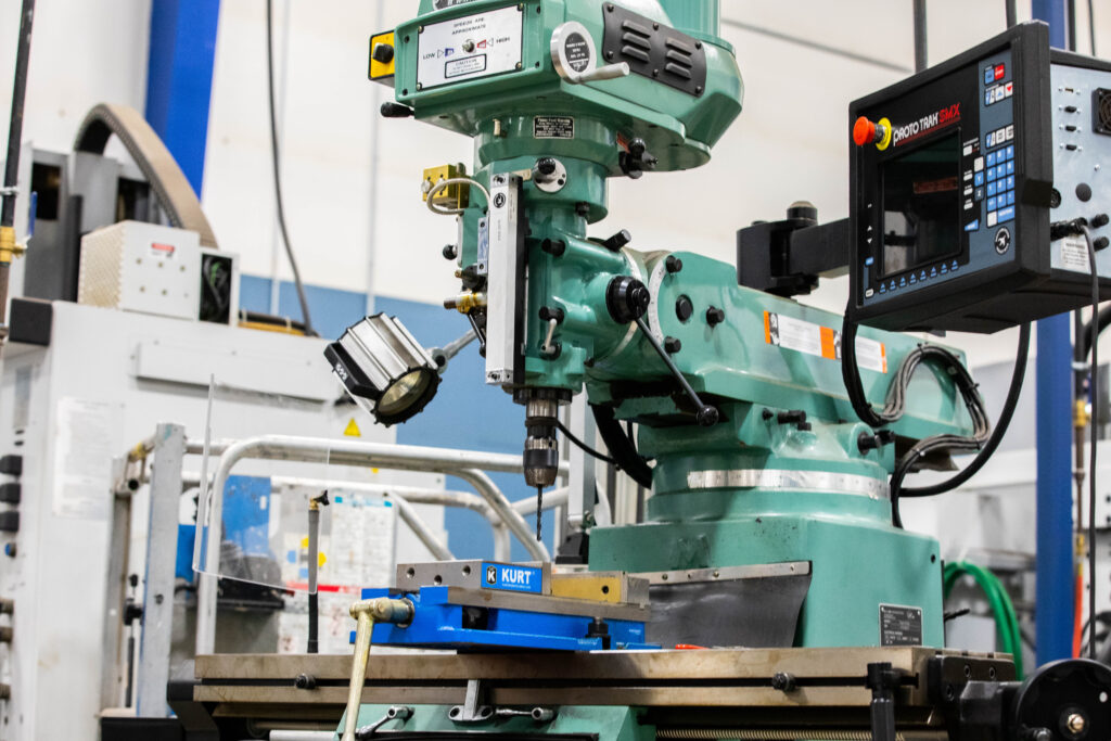 A big green machine drill you would commonly find in a workshop